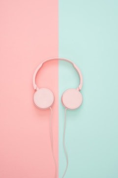 Headphones in pink and blue background