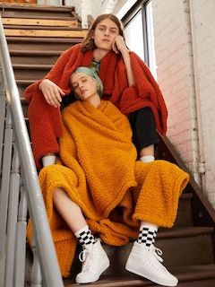 Two people sitting on the stairs